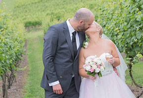 Kissing in the vineyard. Husband and Wife. © Erika's Way Wedding Photography