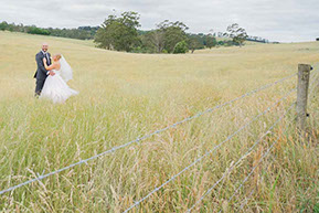 Husband and Wife in the yellow field © Erika's Way Wedding Photography in Melbourne