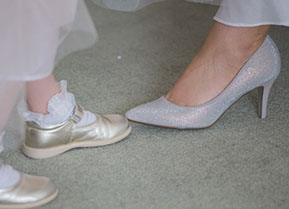 the bride's Shoes vs the flower girl's shoes. :) © Erika's Way Photography