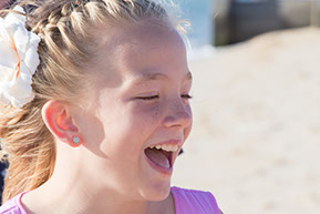 Flower girl smiling at Safety Beach, Mornington Peninsula, Vic. © Erika's Way Photography